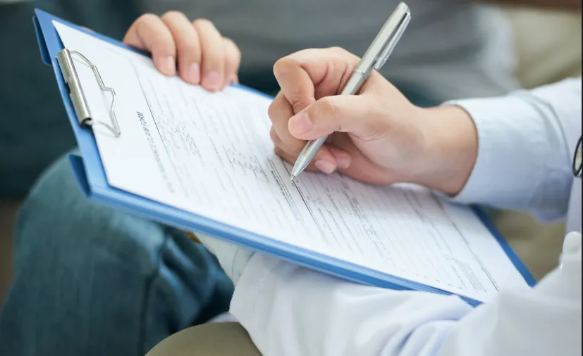 Stack of printed reports and charts.