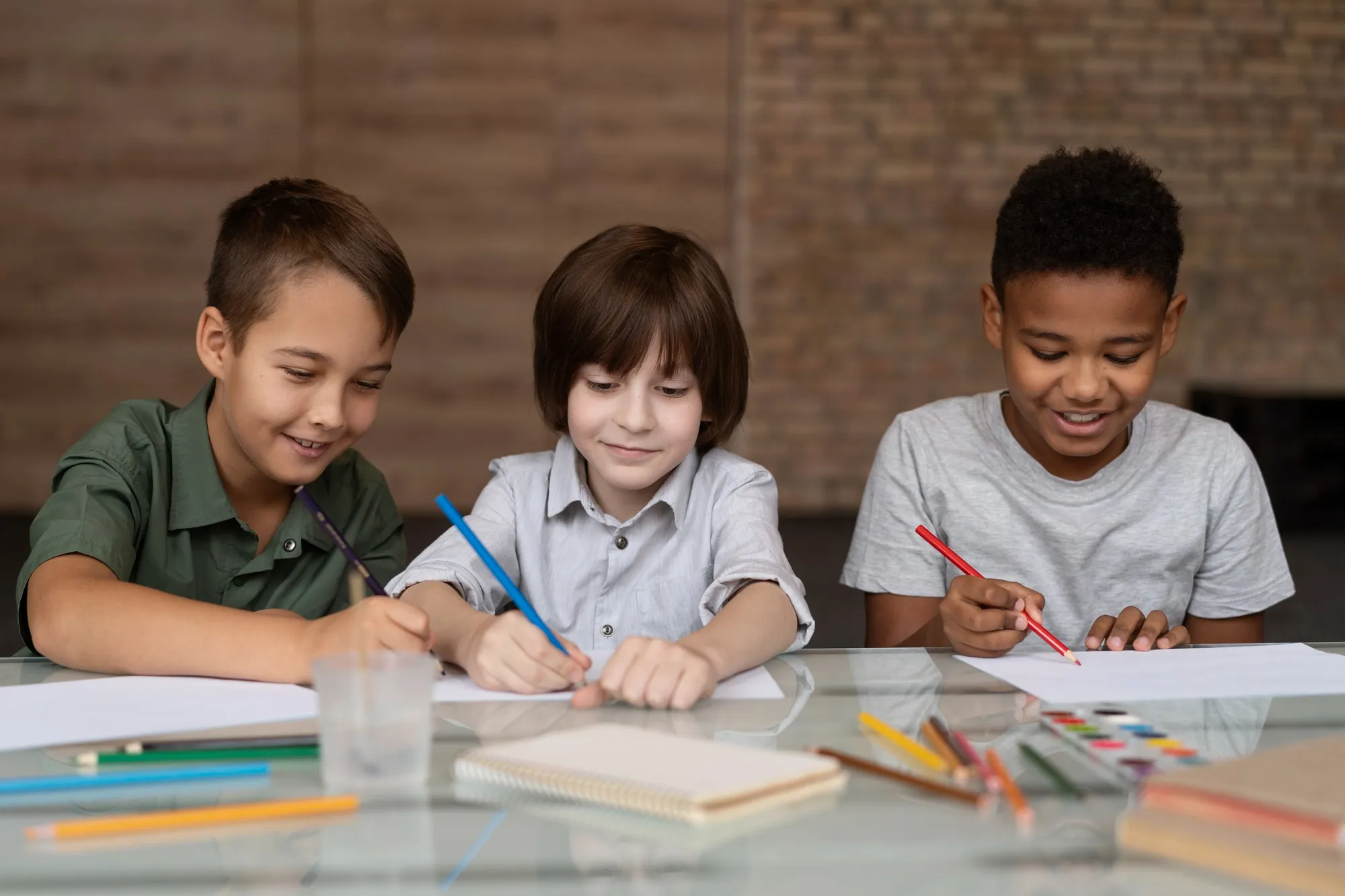 Young students collaborating at a classroom table.